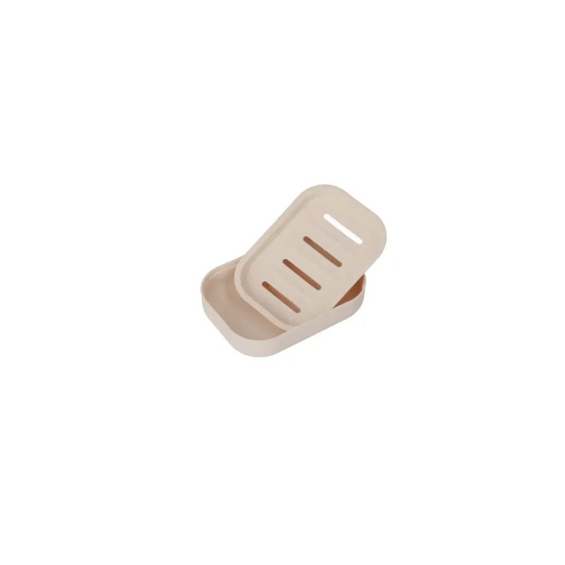 A Nölle Profi Brush Seifendose aus Kunststoff (10,5 x 7,5 x 4 cm), beige, mit abnehmbarem Schlitzdeckel, teilweise geöffnet und auf weißem Hintergrund gezeigt. Perfekt als Reisebegleiter. Die Packung enthält 12 Dosen.